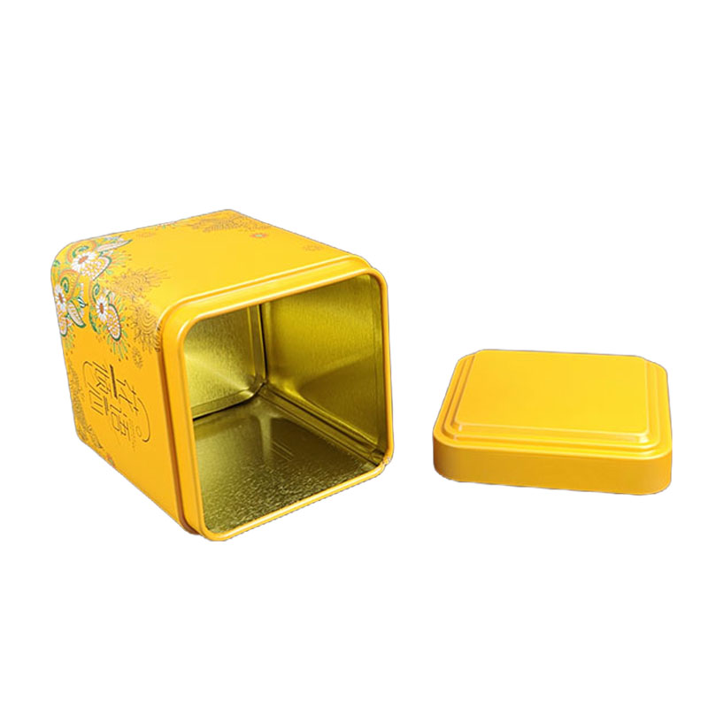 Boîte à thé jaune ouverte avec couvercle amovible