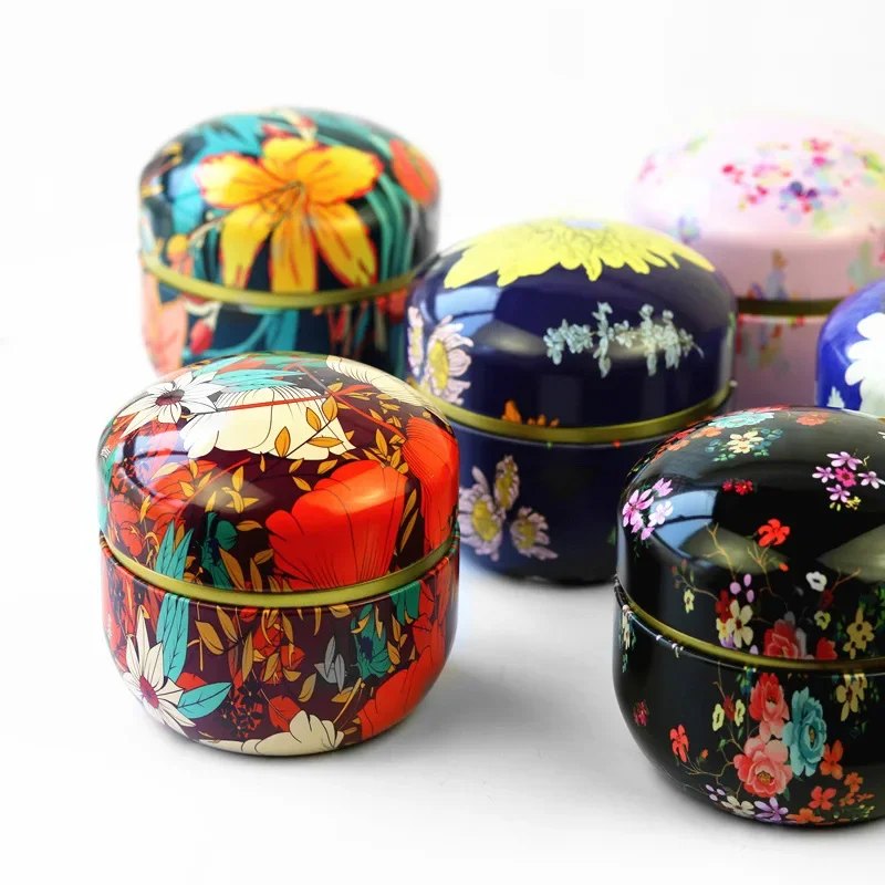 Lot de 8 boîtes à thé rondes en fer-blanc motifs floraux