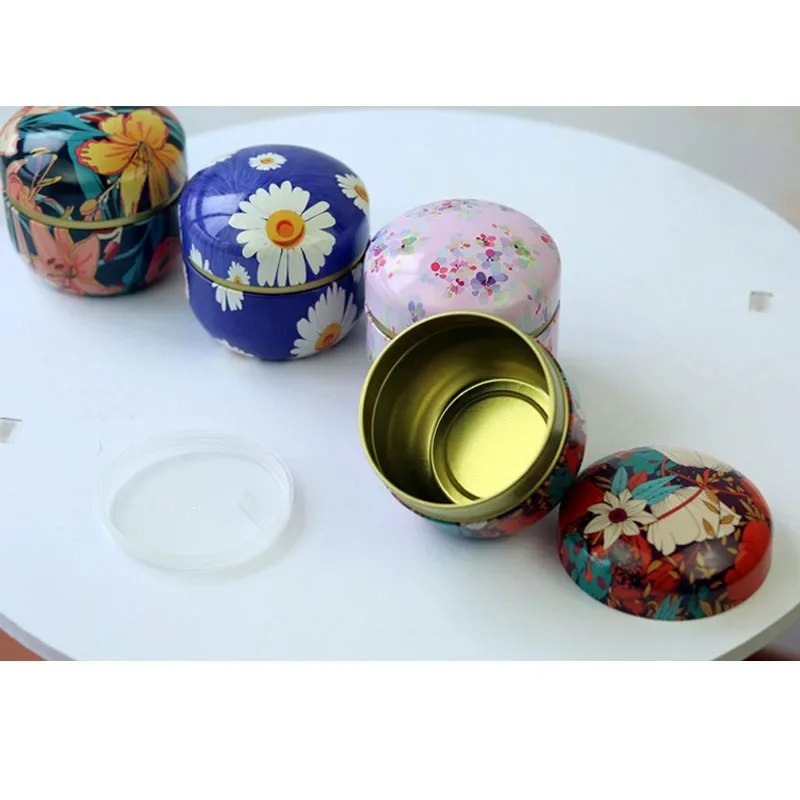 Lot de 8 boîtes à thé rondes en fer-blanc motifs floraux